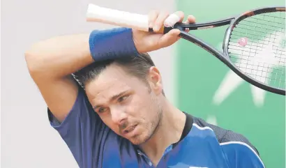  ?? Picture: AFP ?? BYE BYE. Former champion Stanislas Wawrinka (above) was sent packing by Guillermo Garcia-Lopez in the first round of the French Open at Roland Garros yesterday.