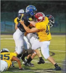  ??  ?? Neshaminy’s Brian Toal (R) stops Pennridge’s Mike Supp.