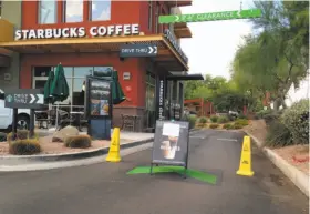  ?? Traci Carl / Associated Press ?? A Starbucks in Phoenix is closed Friday because of a glitch in its cash register network. Company-operated stores in the U.S. and Canada were affected.