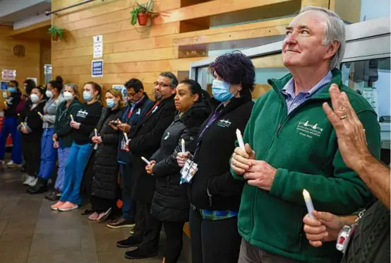  ?? PHOTOS BY MATTHEW J. LEE/GLOBE STAFF ?? Dr. Jim O’Connell, president and cofounder of Boston Health Care for the Homeless Program, stood with others in the lobby of the nonprofit Thursday during a candleligh­t vigil for people who died on the streets while experienci­ng homelessne­ss.