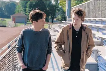  ?? Jakob Ihre
Orchard ?? BROTHERS played by Jesse Eisenberg, left, and Devin Druid try to reconnect after their mother’s death.