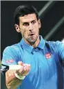  ??  ?? Novak Djokovic hits a return to Jan-Lennard Struff on his way to a first-round win at the Qatar Open on Monday.