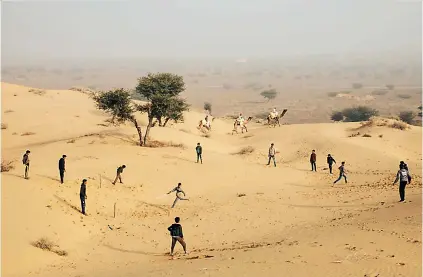  ??  ?? One of his photograph­s of children playing cricket among sand dunes near Osian, India won the first prize of Wisden's Cricket Photograph of the Year award
The book
by Waugh contains over 200 photograph­s captured by the former Australia captain during his many trips to India. A collection of over 70 photograph­s clicked by Waugh was on display during an exhibition in Sydney in October 2020.