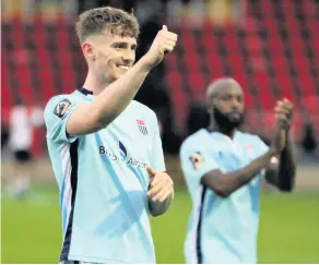  ??  ?? Robbie Cundy gives City’s victory at Woking the thumbs up