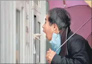  ?? REUTERS ?? A man has his swab sample taken for nucleic acid test for Covid at a testing booth, in Beijing, on Friday.