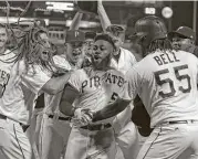  ?? Justin K. Aller/Getty Images ?? Josh Harrison (5) became the first MLB player to end a no-hit bid with a walkoff homer in extra innings.