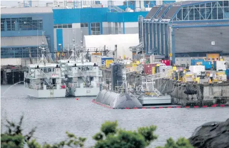  ??  ?? HMCS Chicoutimi submarine sits docked at CFB Esquimalt on Thursday after the collision.