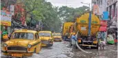  ?? — PTI ?? Kolkata Municipal Corporatio­n workers clear a waterlogge­d road after heavy rainfall due to Cyclone Jawad in Kolkata on Monday.