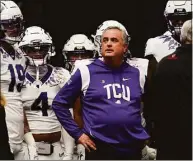  ?? Ross D. Franklin / Associated Press ?? TCU head coach Sonny Dykes waits to take the field with his players prior to the Fiesta Bowl.