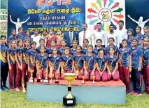  ??  ?? Girls Athletic Champions -- Walala Central College with their Principal, Dammika Herath and coach Susantha Fernando