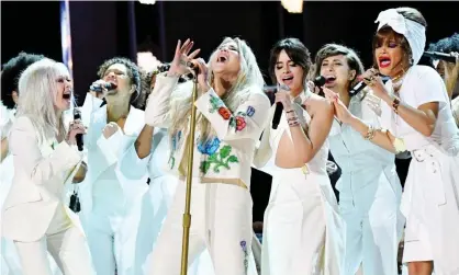  ?? Photograph: Jeff Kravitz/FilmMagic ?? Kesha performs at the 2018 Grammys with Bebe Rexha, Cyndi Lauper, Kesha, Camila Cabello, AndraDay and Julia Michaels.