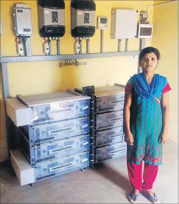  ?? GAYATRI JAYARAMAN/HT ?? ■ 21yearold Manisha Anand Tawad from Tundepada manages the fencedin solar microgrid for her hamlet.