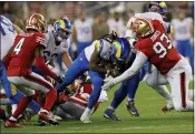  ?? JANE TYSKA — BAY AREA NEWS GROUP ?? San Francisco 49ers’ D.J. Jones #93 tackles Los Angeles Rams’ Darrell Henderson #27in the second quarter of their NFL game against the Los Angeles Rams at Levi’s Stadium in Santa Clara on Monday.