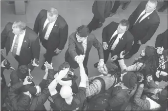  ?? CP PHOTO ?? Prime Minister Justin Trudeau is surrounded by his security detail as he greets students during a visit to Georgian College in Barrie, Ont.