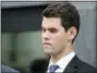  ?? PHOEBE SHEEHAN/CENTRE DAILY TIMES VIA AP ?? Former Beta Theta Pi brother Ryan Burke listens as his attorney, Philip Masorti, speaks to the press Tuesday, July 31, at the Centre County Courthouse Annex in Bellefonte, Pa.