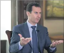  ?? THE ASSOCIATED PRESS ?? Syrian President Bashar Assad speaks to The Associated Press at the presidenti­al palace in Damascus, Syria in 2016.
