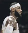  ?? Photos by Ringo H.W. Chiu Associated Press ?? LeBRON JAMES is back after two negative COVID-19 tests.