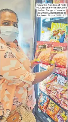  ?? Picture: SUPPLIED ?? Priyanka Nandan of Field 40, Lautoka with McCain’s Indian Range of snacks at Extra Supermarke­t in Lautoka.