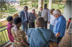  ??  ?? In Kigali, World Vision’s national director Sean Kerrigan, and Rich and Renée Stearns meet with genocide survivors: Callixte Karemangin­go and his wife Marcella, and Andrew Birasa and his wife Madrine.