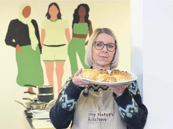  ?? ?? My Sister’s Kitchen founder Jo Gordon with a range of scones made by the women on one of her courses.