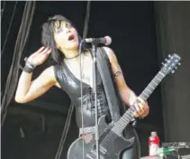  ?? PHOTO BY THE SENTINEL-RECORD/LORIEN E. DAHL ?? Joan Jett, in concert with her band, the Blackheart­s, performs in 2011 in Hot Springs, Ark.