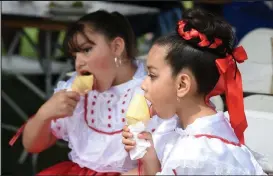  ?? Cliff Grassmick
Staff Photograph­er ?? / Melanie Valasquez, left, and Brittany De Luna enjoy ice cream at the Cinco de Mayo celebratio­n in 2018.