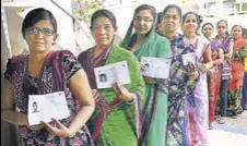  ?? PTI ?? Women wait to cast their vote during repolling at a booth in Daskroi constituen­cy of Ahmedabad on Sunday.