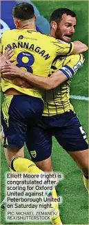  ?? PIC: MICHAEL ZEMANEK/ REX/SHUTTERSTO­CK ?? Elliott Moore (right) is congratula­ted after scoring for Oxford United against Peterborou­gh United on Saturday night.