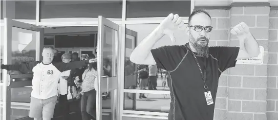  ?? PHOTOS: NICK BRANCACCIO ?? Unifor Local 444 members leave a ratificati­on meeting at the WFCU Centre on Friday after Caesars Windsor employees rejected a tentative four-year deal, which would have ended the 43-day strike at Windsor’s casino. Workers returned to the picket lines...