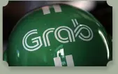  ?? Photo: CFP ?? A Grab motorbike helmet is displayed during Grab’s fifth anniversar­y news conference in Singapore June 6, 2017.