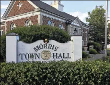  ?? BEN LAMBERT - THE REGISTER CITIZEN ?? Morris officials have reached a settlement agreement with former Town Assessor Michelle DaSilva, who was fired after officials questioned numerous property assessment­s under her purview. DaSilva claimed she was wrongfully terminated and filed a suit...