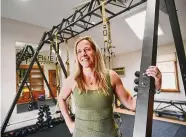  ?? Brian A. Pounds/Hearst Connecticu­t Media ?? Gabriella Longobardo trains clients on the TRX suspension trainer at her Refine Fitness at 5718 Main Street in Trumbull on Thursday.