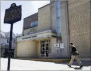  ?? MATT ROURKE — THE ASSOCIATED PRESS ?? In this photo a person walks past former home of the television program American Bandstand in Philadelph­ia. Philadelph­ia has a rich musical legacy: It’s birthplace of the lush acoustic style known as The Sound of Philadelph­ia and the hometown of...