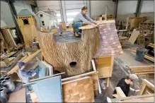  ?? Herald photo by Ian Martens ?? Senta Miller, Brad Corrigan and Stephanie Johansen work on Charmed Playhouse creations at the company’s facility east of Lethbridge. The company will again be featured on TLC’s reality series “Playhouse Masters.” @IMartensHe­rald