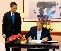  ?? AFP ?? Hong Kong Chief Executive Leung Chun-ying watches as Prime Minister Nawaz Sharif signs a guest book at the Government House in Hong Kong. —