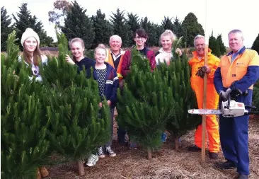  ??  ?? Warragul Regional College students help harvest some of the 1200 Christmas trees sold each year by Warragul Rotary Club (from left) Maddie McDonald, Steph Garlick, Emily Sheil, Peter Dell, Tegan O’Dea, Phoebe Graham, Vaughan Fox and Geoff Chilver.