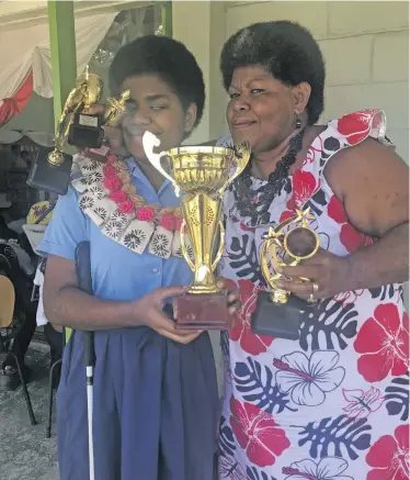  ?? Photo: Wati Talebula ?? Proud mother Neini Nasalato hugs her daughter Naomi Lewakita after Naomi was named dux of the Fiji School for the Blind during their prizegivin­g ceremony at Vatuwaqa, Suva on November 22, 2018.