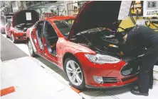  ?? JEFF CHIU/THE ASSOCIATED PRESS FILES ?? Tesla is suing Alameda County for preventing its plant in Fremont, Calif., from reopening.