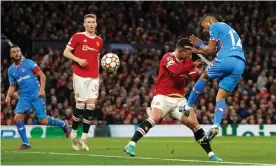  ?? Photograph: Martin Rickett/PA ?? Renan Lodi leaps unchalleng­ed to head the ball into the Manchester United net.