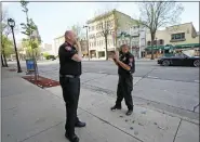  ?? MIKE DE SISTI/MILWAUKEE JOURNAL-SENTINEL VIA AP ?? MSOE Public Safety officers investigat­e the scene of a shooting near the corner of North Water Street and East Juneau Avenue in Milwaukee, Saturday, where multiple were shot and injured late Friday in Milwaukee’s downtown bar district after the Milwaukee Bucks playoff game.