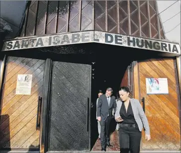  ?? Esteban Felix Associated Press ?? CHILE’S DEPUTY Interior Secretary Mahmud Aleuy exits one of three churches firebombed Friday in Santiago. Leaflets left behind criticized the upcoming papal visit and called for a “free” Mapuche nation.