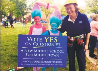  ?? Contribute­d photo ?? Middletown School Yes supporters set up a table on Main Street as part of the city’s Halloween trick-or-treat event Saturday. Supporters are spreading the word about the referendum question that, if passed, would allow constructi­on to begin on a new...