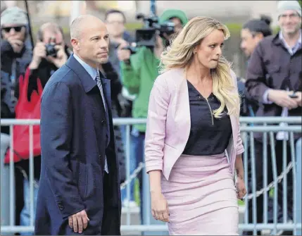 ?? Seth Wenig / Associated Press ?? in this April 16, 2018, file photo, attorney michael Avenatti and his client Stormy daniels leave federal court in new York. At a nxivm pretrial hearing on Wednesday, a judge asked Clare Bronfman, the group’s operations director, if Avenatti was secretly representi­ng her.