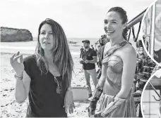  ?? CLAY ENOS ?? Director Patty Jenkins, left with Gadot, says, “It’s got to be great and (Wonder Woman) deserves a great movie.”