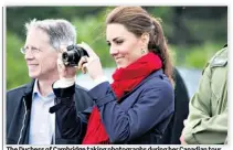  ??  ?? The Duchess of Cambridge taking photograph­s during her Canadian tour