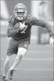  ?? NWA Democrat-Gazette/ANDY SHUPE ?? Arkansas receiver Trey Knox runs up field after making a catch Friday during spring practice. Improving the wide receivers’ ability to make plays is a priority for the Razorbacks, who had 88 plays of 10 or more yards last year.