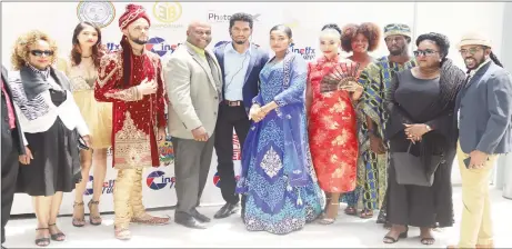  ??  ?? Founder and CEO of Cineffx Jason October (center) flanked by models and speakers of the Cineffx Photo and Film exhibition following the official opening yesterday at the Arthur Chung Conference Centre. (Terrence Thompson photo)