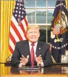  ?? Carlos Barria / AFP / Getty Images ?? President Donald Trump delivers a televised address to the nation on funding for a border wall from the Oval Office of the White House in Washington on Tuesday.