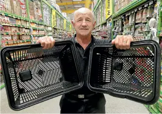  ?? PHOTO: KENT BLECHYNDEN/STUFF ?? Petone supermarke­t owner Leo O’sullivan can remember a time when his store had no baskets. Now they’re fitted with security devices.