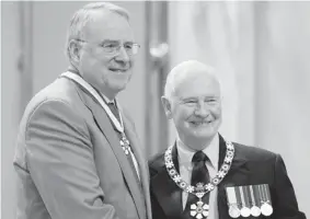  ?? CANADIAN PRESS FILES ?? Governor General David Johnston, right, invested Ken Dryden as an Officer of the Order of Canada last year. Dryden won six Stanley Cups during his eight seasons with the Canadiens.